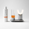 Eine Flasche des manadental Liquids und das manadental Produktsystem vor weißem Hintergrund - Abbildung für den Online Shop